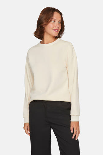 Gilet beige de VILA®, porté avec un pantalon noir, sur un fond blanc.