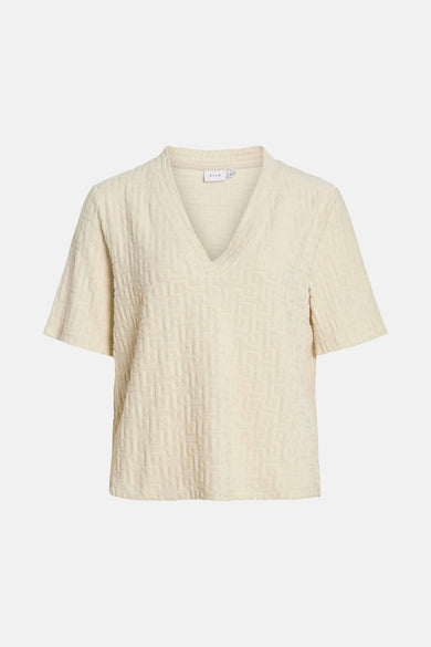 T-shirt écru à manches courtes de VILA, avec un motif relief marqué.