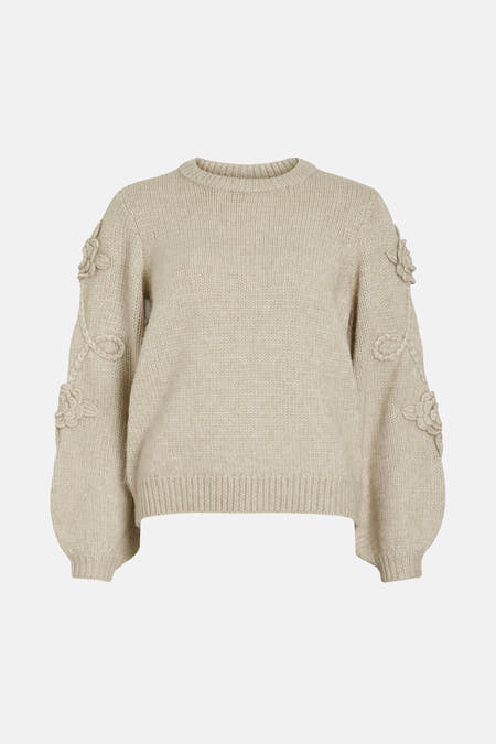 Gilet beige avec col rond de VILA, en tissu côtelé et détails floraux sur les manches.
