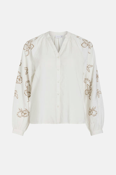 Chemise blanche à manches longues de VILA®, avec broderie de fleurs sur les manches.