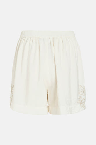 Short blanc de VILA®, avec une ceinture élastique et un travail de broderie de fleurs sur le côté.