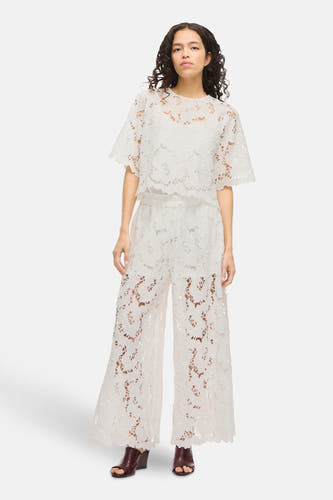 Pantalon blanc de VILA®, avec un motif à l'ouverture et des jambes larges.