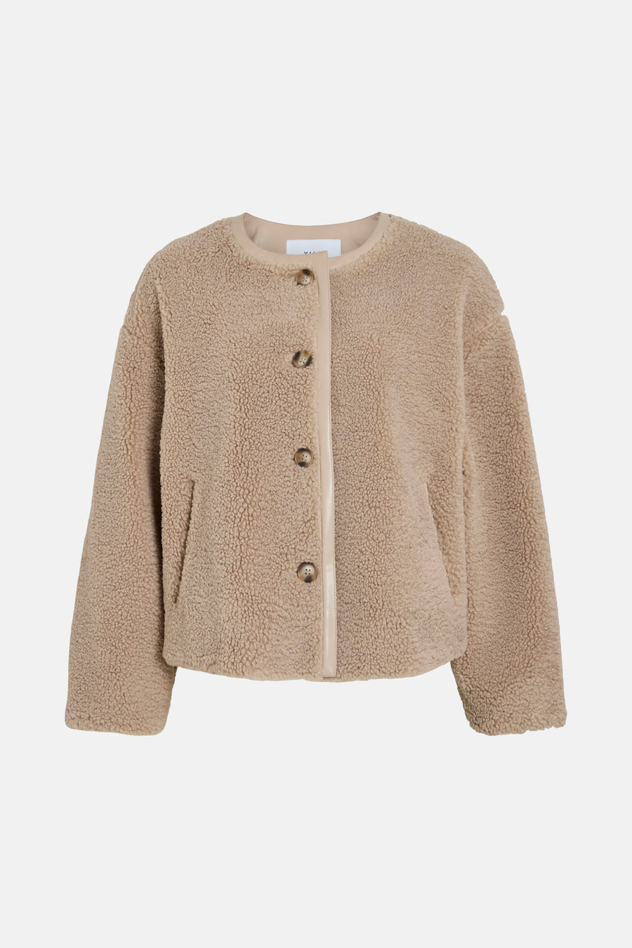 Beige teddy jas met knopen.
