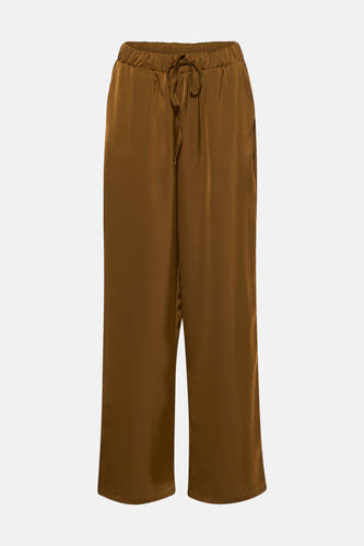 Jean VILA en or avec une ceinture élastique et un cordon de serrage.