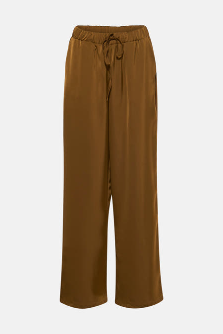 Jean VILA en or avec une ceinture élastique et un cordon de serrage.