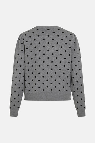 Grijs damesvest met zwarte stippen.