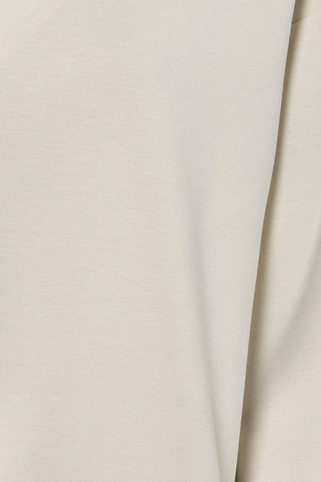 Crèmekleurige sweaterstof.