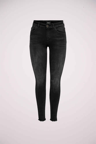 Jean skinny noir ONLY avec un lavage délavé et un bord côtelé.