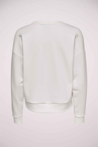 Dos d'un pull couleur crème.