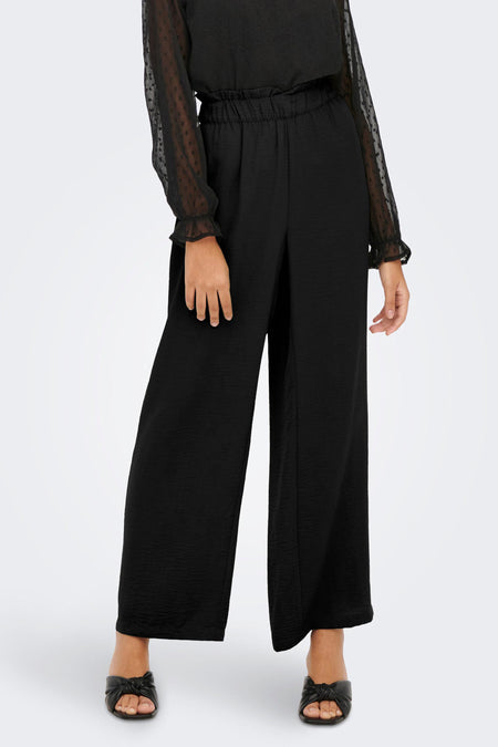 Pantalon noir JDY, avec des jambes larges et une ceinture élastique.
