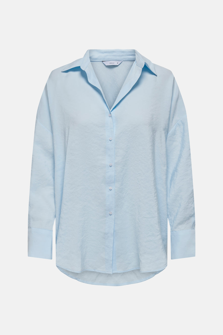 Chemise bleue à manches longues de ONLY, avec une texture froissée et une fermeture à boutons.
