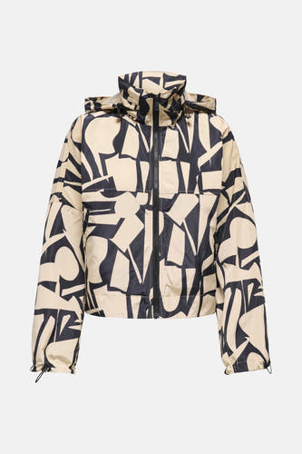 Manteau beige court d'ONLY avec un motif géométrique noir et beige.
