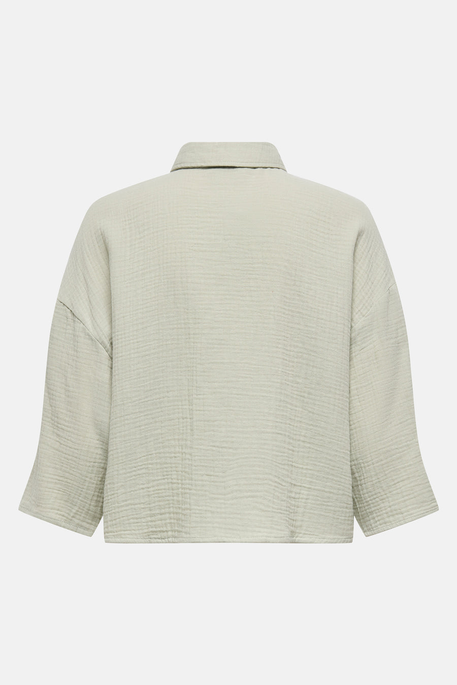 Blouse en coton vert clair à manches courtes.