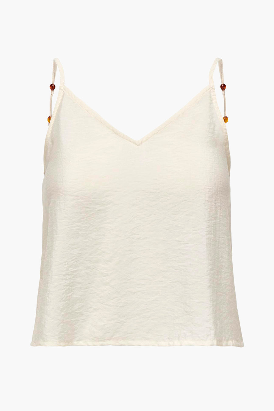 Mouwloze top in gebroken wit met kralen.