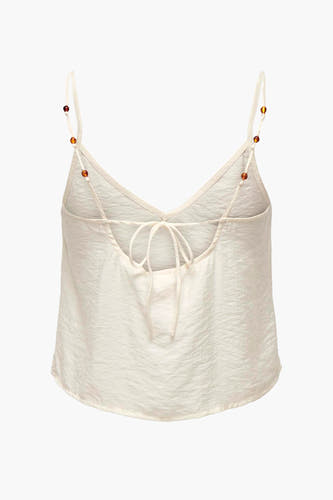 Blouse écrue sans manches ONLY, avec une fine texture et des bandes avec des détails en perles.