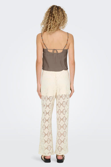 Blouse sans manches brune d'ONLY, avec des perles colorées sur les bords et une fermeture éclair sur le dos.