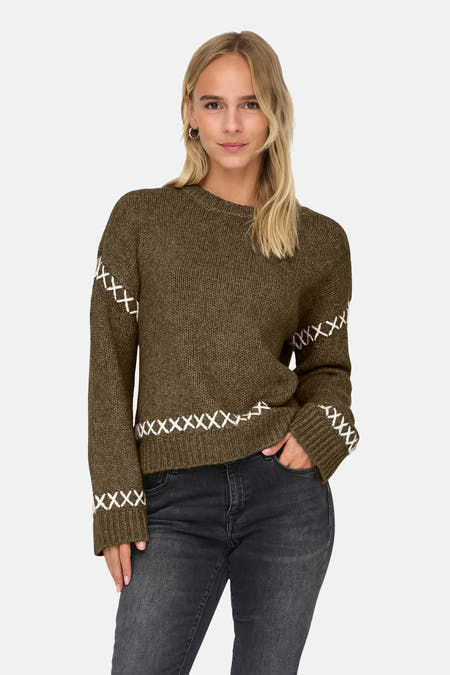 Gilet rond col sans manche ONLY® avec des points blancs et un jeans foncé.