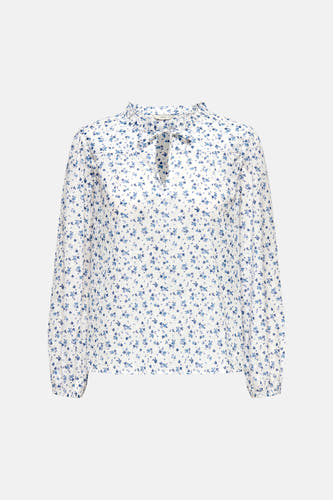 Chemisier blanc à manches longues de ONLY, avec un imprimé floral bleu et un détail de nœud au col.