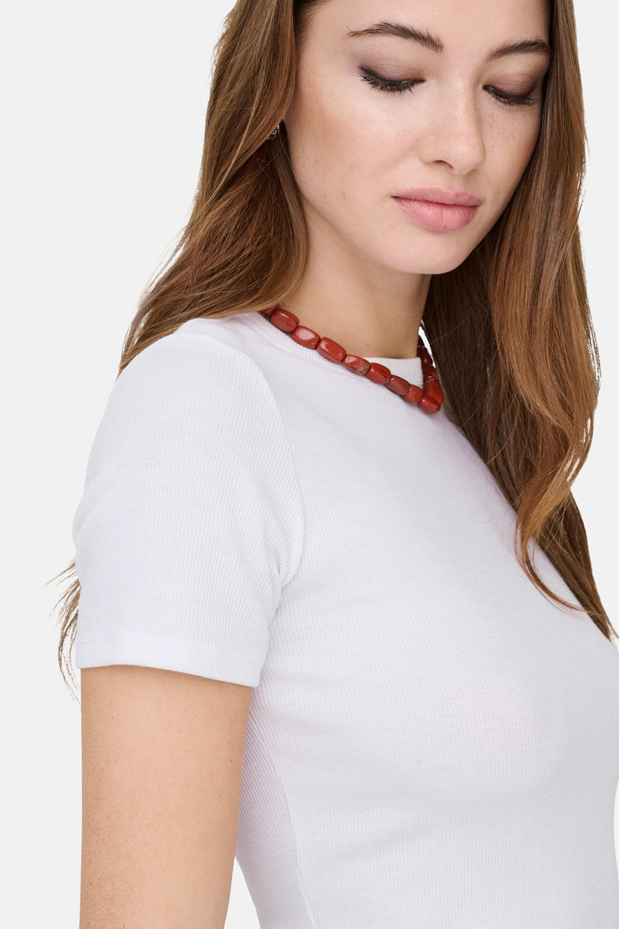 T-shirt blanc à manches courtes ONLY®, avec une texture côtelée fine et un col rond.