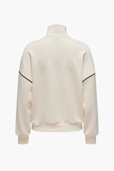 Gilet beige ONLY avec une patte de col noire et un fermeture à glissière devant.