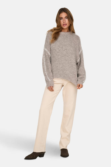 Gilet rond encolé beige de JDY, avec des manches longues et des boutons décoratifs.