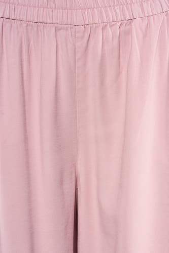 Pantalon rose ONLY® avec taille élastique et texture subtile.