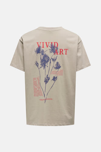 T-shirt beige à manches courtes de ONLY, avec imprimé de fleurs et texte sur le dos.