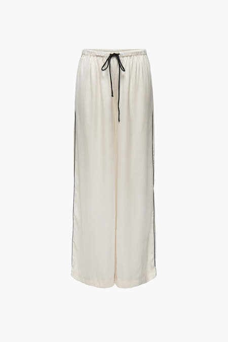 Pantalon écru de JDY avec une patte noire le long du côté et une corde.