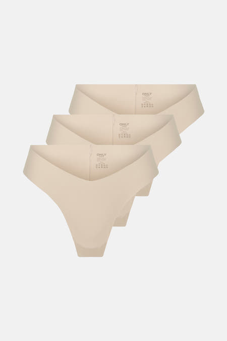 Robe d'entraînement écru ONLY®, empilée et subtilement éclairée sur un fond uni.