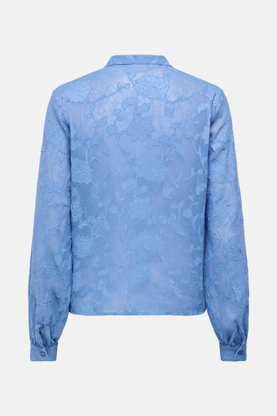 Chemise bleue à manches longues de JDY, avec un motif floral et des poignets à boutons.