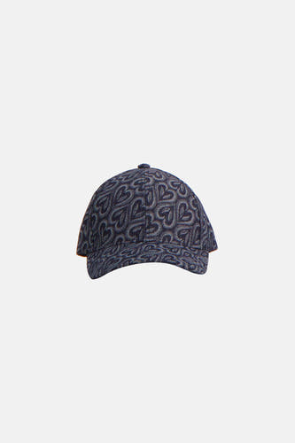 Casquette bleue de ONLY avec un motif de symboles B stylisés répétés et une boucle argentée à l'arrière.