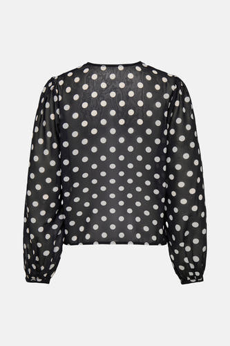 Zwarte blouse met lange mouwen van ONLY, met witte stippen over de hele blouse.
