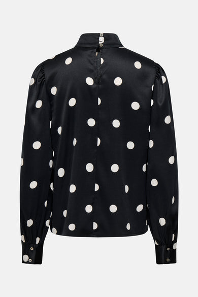 Blouse noire à longues manches ONLY, avec des taches blanches et une fermeture à boutonnière à l'arrière.