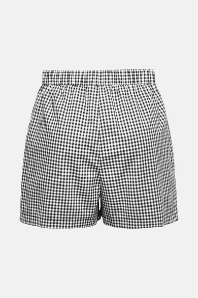 Zwarte short van ONLY® met een schattig zwart-wit geblokt ruitpatroon en elastische tailleband, gezien van achteren.