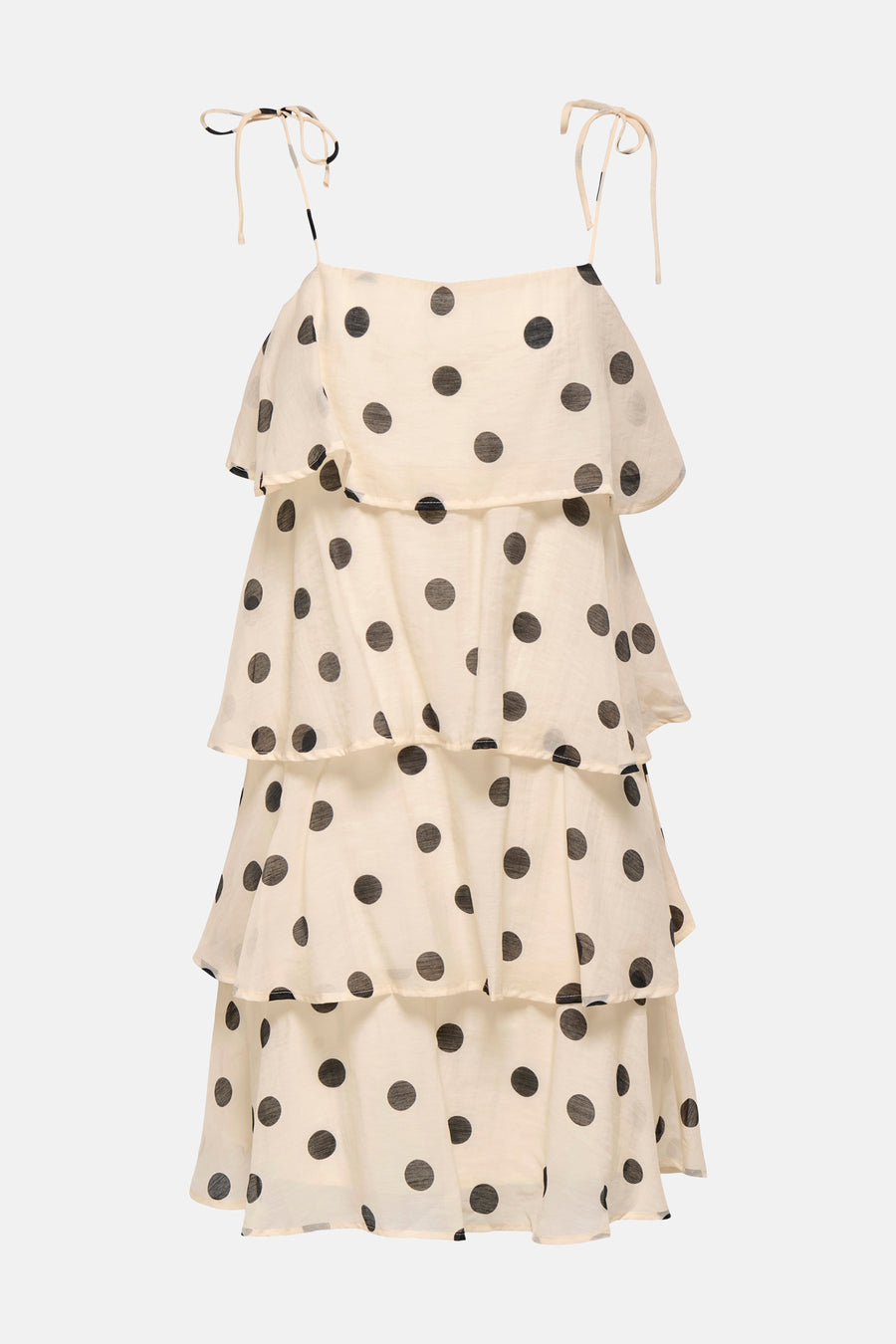 Robe écru de JDY avec bretelles spaghetti, détails de nœud et un motif à pois noirs dans plusieurs volants superposés.