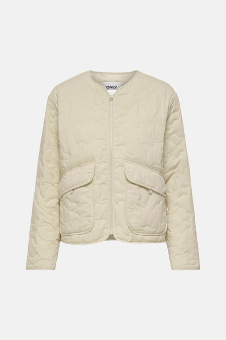 Veste courte de couleur écru d'ONLY, avec un motif de trèfle matelassé.