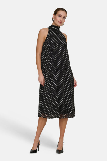 Robe sans manches noire de JDY à pois blancs, col montant et coupe évasée.