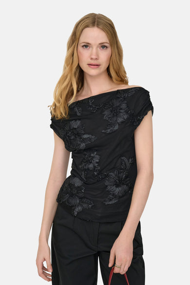 Blouse noire à manches courtes de JDY, avec des motifs floraux.
