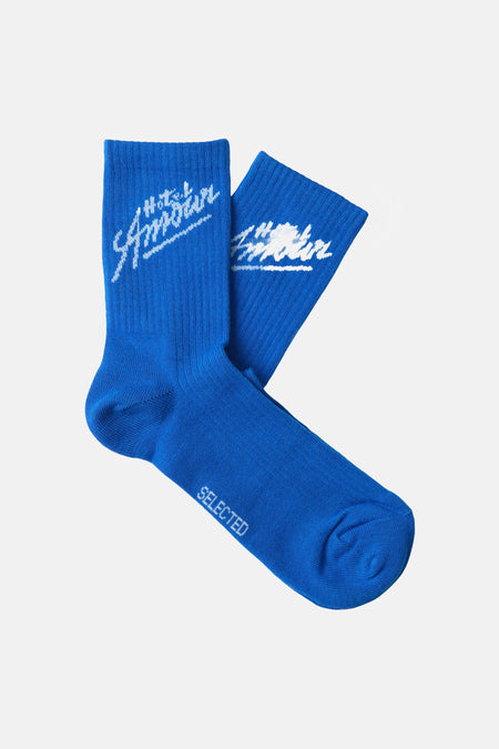 Chaussettes de baskets bleues de SELECTED, avec imprimé logo blanc et texture côtelée.