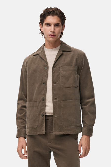 Chemise grise à manches longues de MANGO, dos visible, avec col et poignets contrastants.