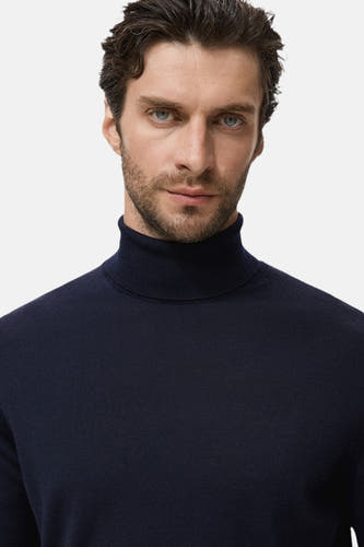 T-shirt bleu avec col rond de MANGO, couleur unie et texture fine côtelée.