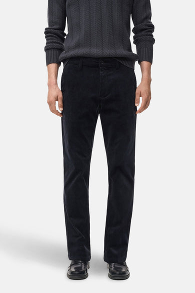 Pantalon bleu de MANGO, fabriqué en corduroy avec poches et fermeture à glissière.