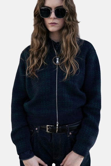 Multikleurig gilet van MANGO, met een ritssluiting aan de voorkant en een geruit patroon.