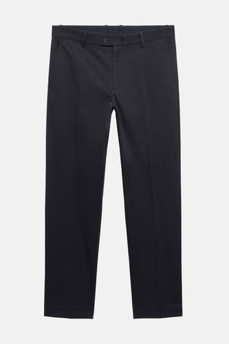 Pantalon bleu marine de MANGO, uni et propre, avec une jambe droite et un boutonnière.