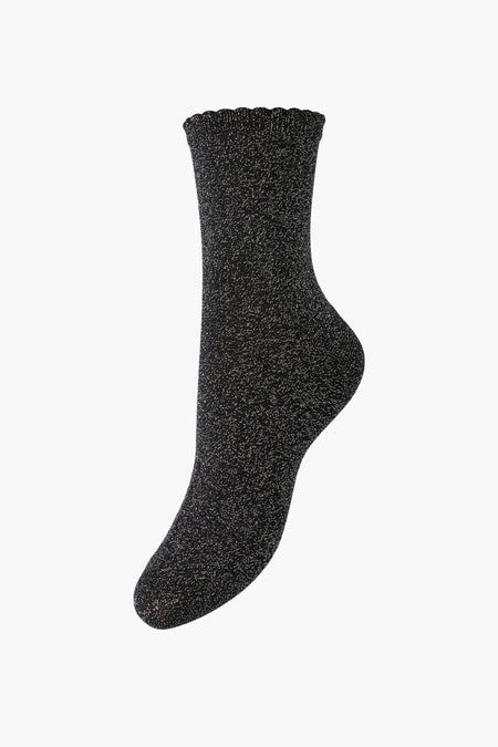 Chaussette noire brillante avec bord côtelé de PIECES®, vue latérale, texture fine