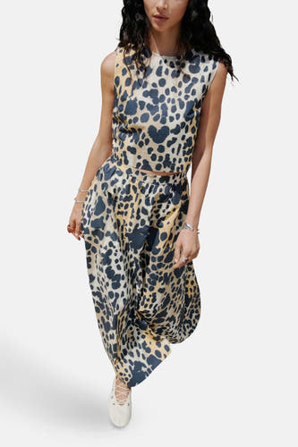 Blouse sans manches beige de MANGO, avec un imprimé d'animaux bleu foncé et jaune.