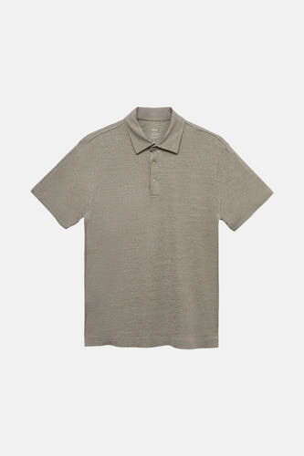 Polo vert de mantes courtes de MANGO, avec une subtile texture et une fermeture à boutons.