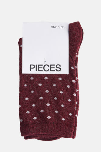Chaussettes rouges de PIECES, avec des taches blanches et des détails scintillants.