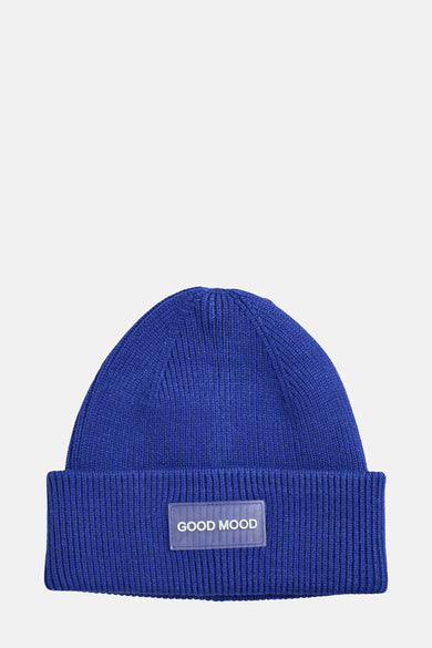 Casquette bleue PIECES® avec texture côtelée et logo "Good Mood" rectangulaire à l'avant.