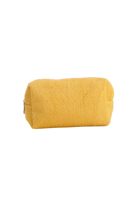 Trousse de toilette en tissu éponge jaune de PIECES® avec fermeture éclair, vue de côté.
